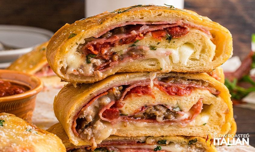 stacked slices of stromboli showing the inside layers