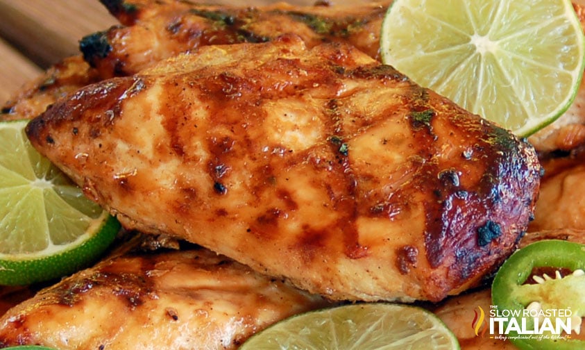 close up: grilled chicken with lime and jalapeno slices