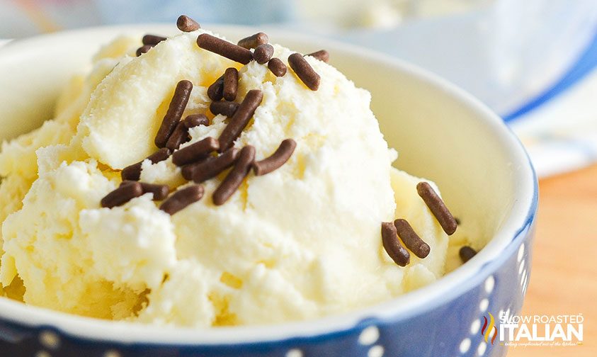 vanilla ice cream with chocolate sprinkles in blue bowl