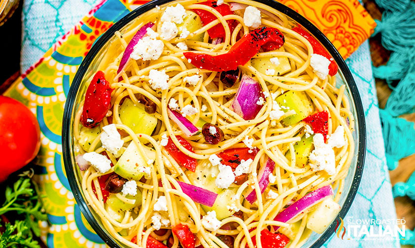 overhead: spaghetti pasta salad with greek veggies