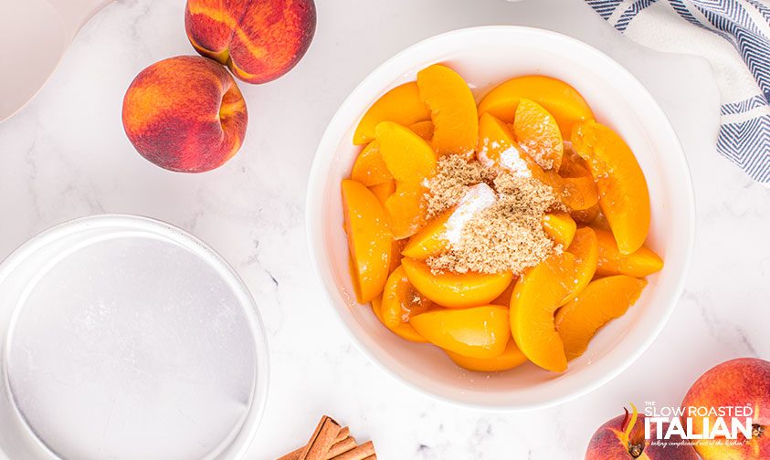 canned peaches in a bowl with brown sugar and cornstarch