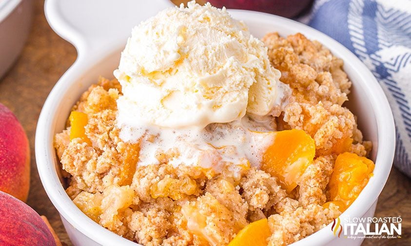 individual peach crisp topped with ice cream