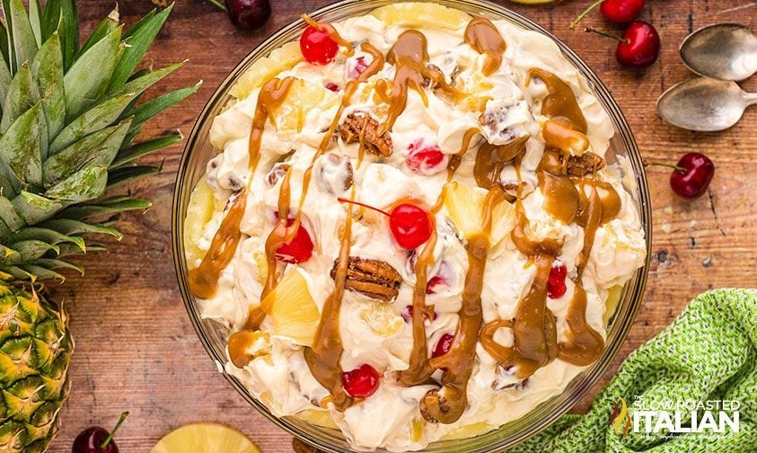 pineapple upside down cheesecake salad topped with caramel sauce