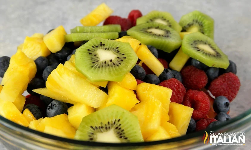 kiwi, pineapple, and berries in bowl