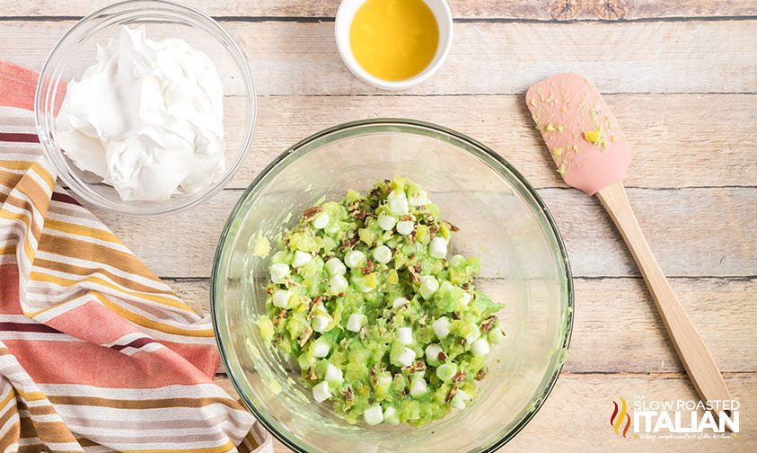 base for pistachio fluff in bowl next to whipped topping