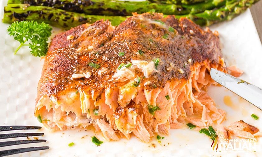 piece of smoked salmon on plate with asparagus