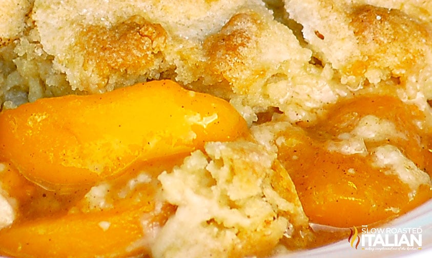 closeup of spiced peaches with cobbler topping