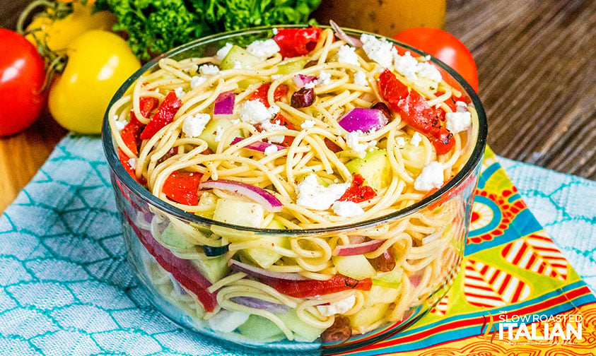 greek spaghetti salad in clear bowl