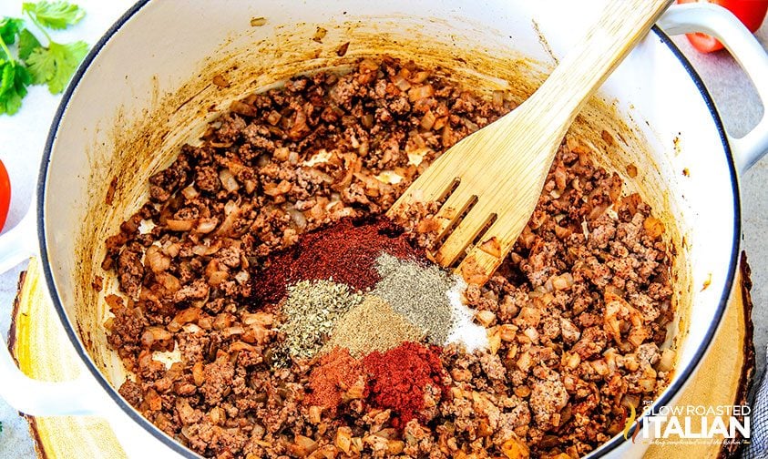 stirring spices into browned ground beef