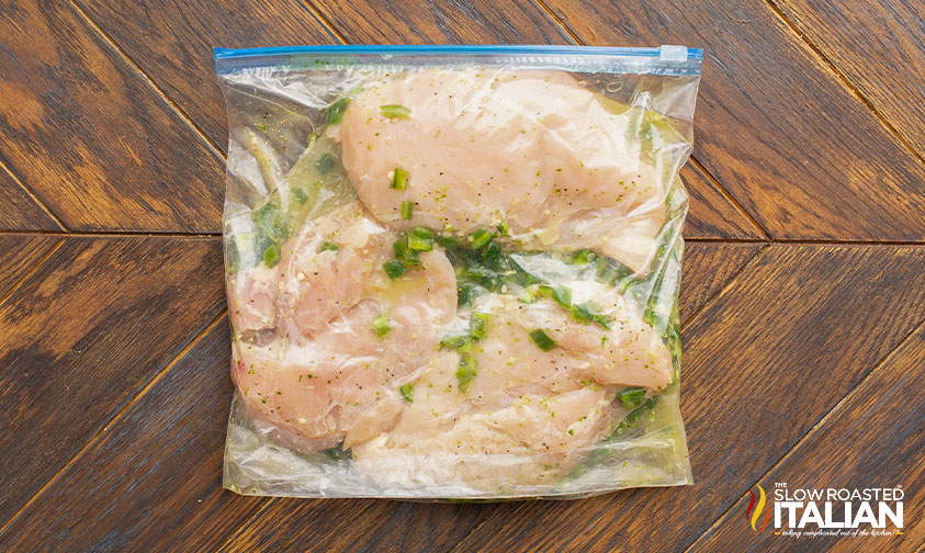 large ziploc of chicken breasts in tequila lime marinade
