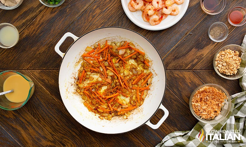 sauteed onion and carrots in skillet