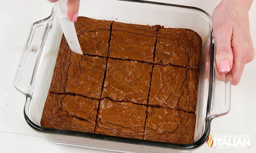 slicing brownies with plastic knife