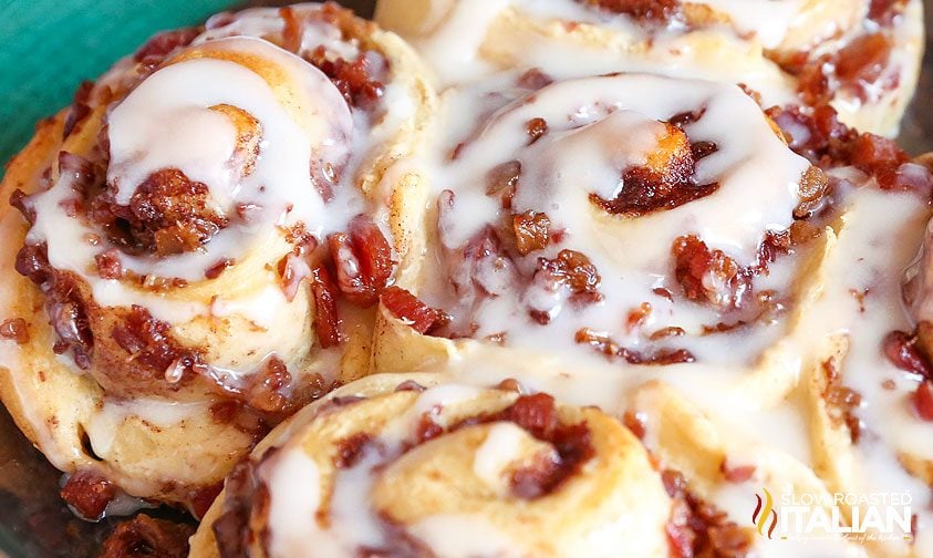 baked cinnamon rolls with bacon and icing on top