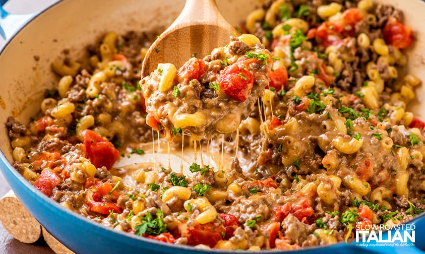 cooked homemade hamburger helper on a wooden spoon