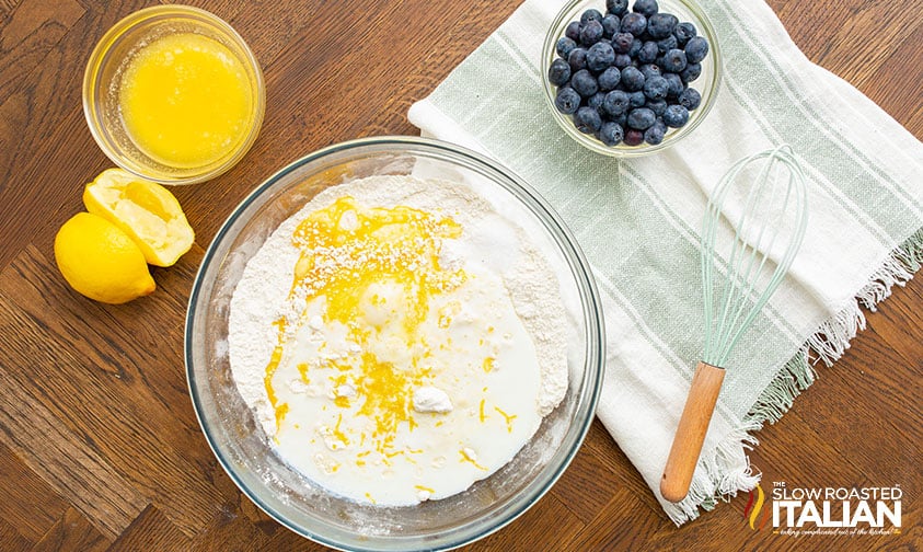 mixing batter for fluffy blueberry pancakes