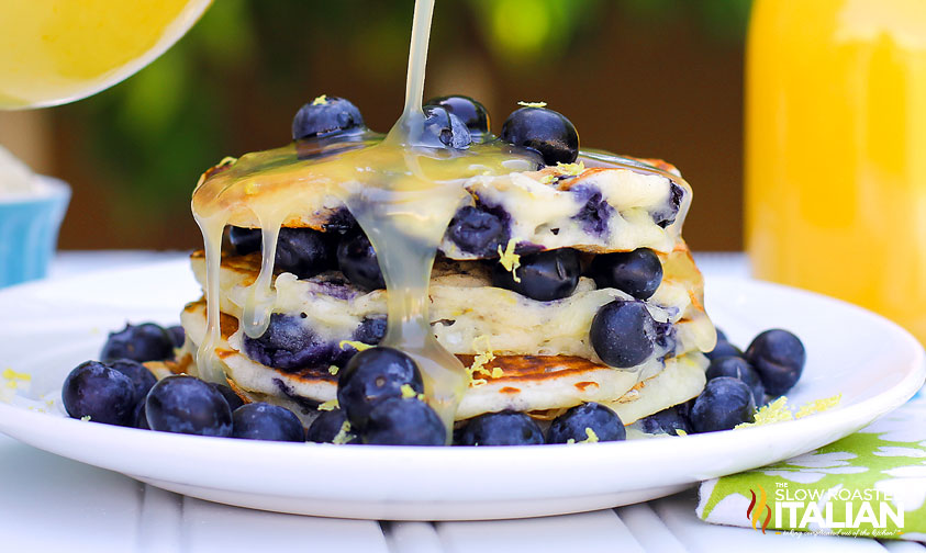 stacked blueberry pancakes on a plate