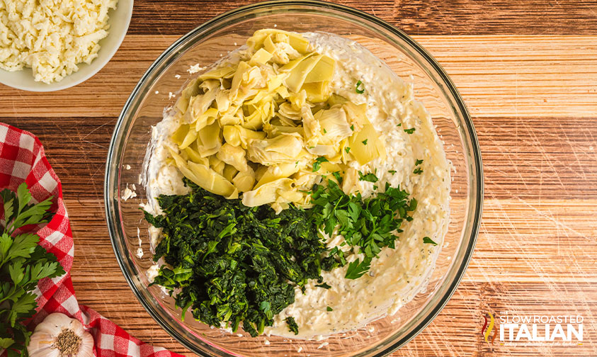 olive garden spinach artichoke dip ingredients in a mixing bowl