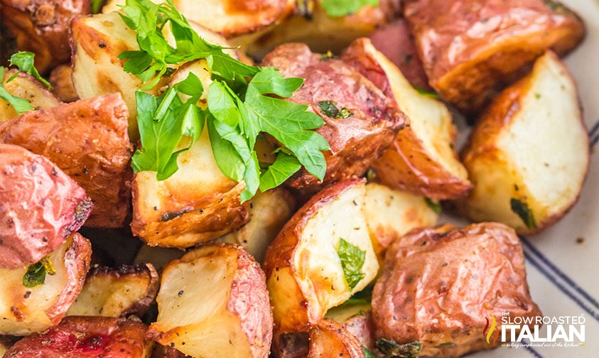 close up: seasoned red potatoes with fresh parsley
