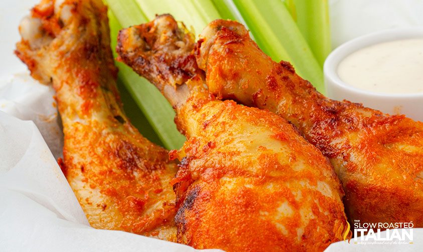 basket of buffalo drumsticks with celery and dip