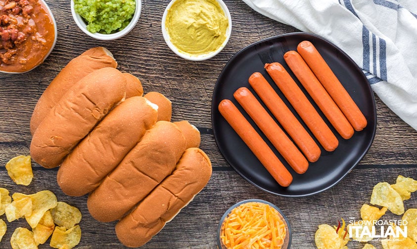 hot dogs, buns, plus various toppings