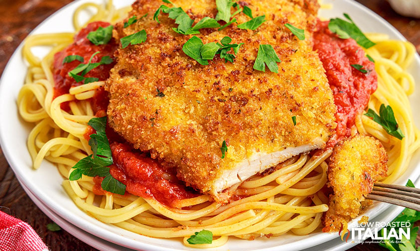 breaded cutlet over pasta and red sauce