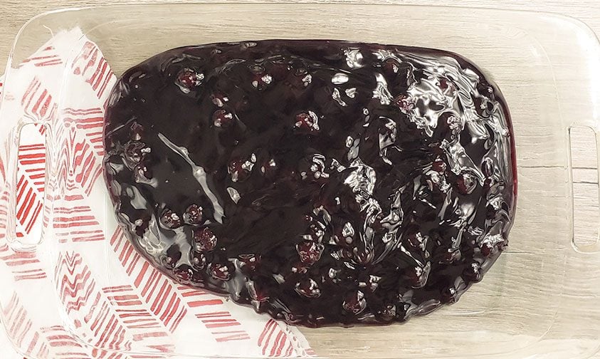 blueberry pie filling in glass baking dish