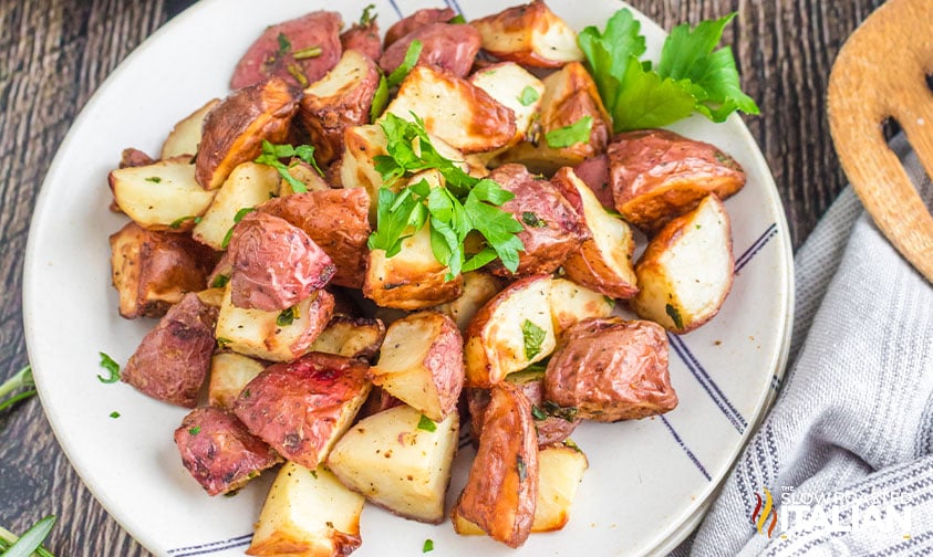 plate of air fried red potatoes topped with herbs