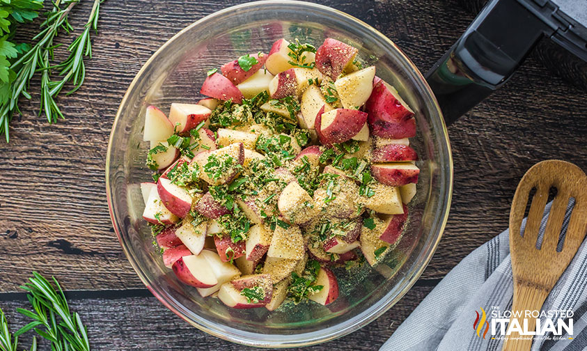 red potatoes covered with spices and seasonings