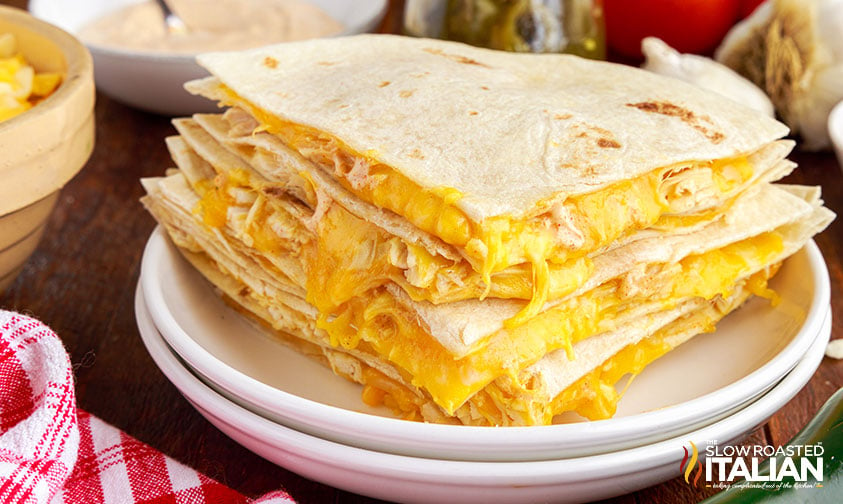 chicken quesadilla slices stacked on plate