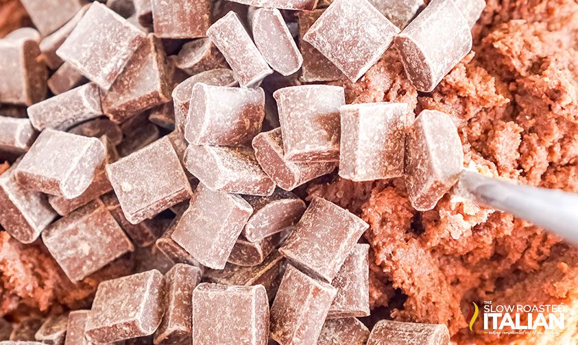 closeup: chocolate chunks on top of chocolate cookie dough