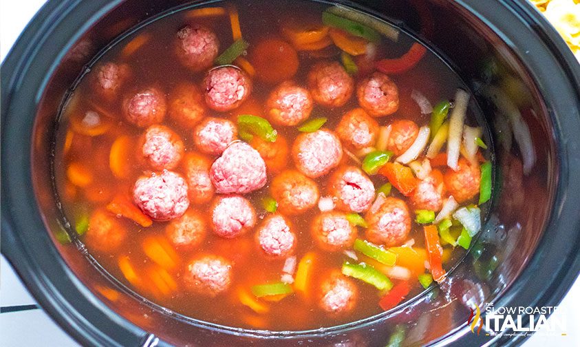 meatballs, veggies, and liquid in slow cooker
