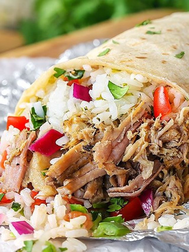 ingredients spilling out of carnitas burrito