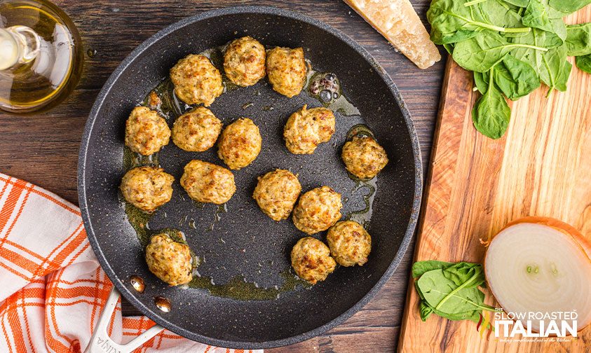 browned meatballs in skillet