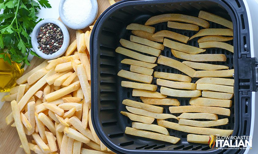 single layer of frozen fries in air fryer basket