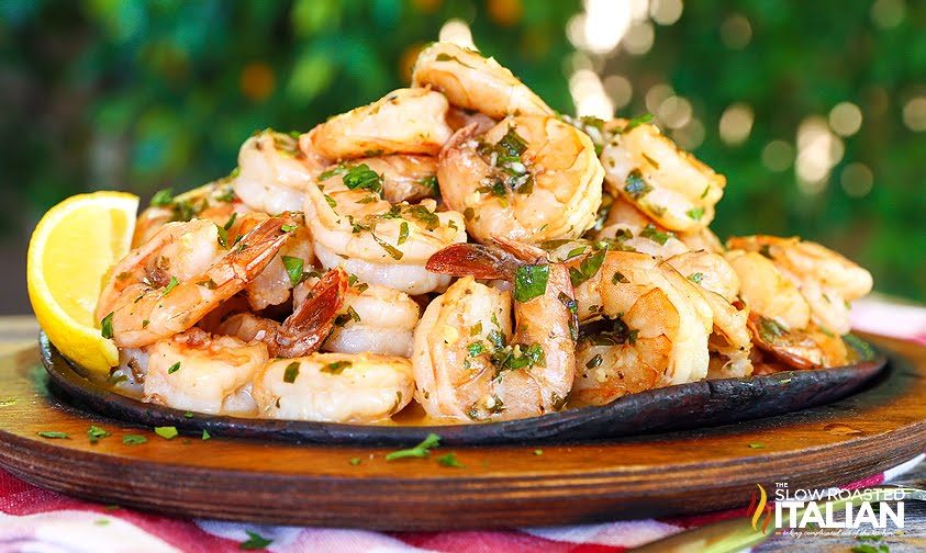 pile of shrimp with lemon garlic sauce and herbs