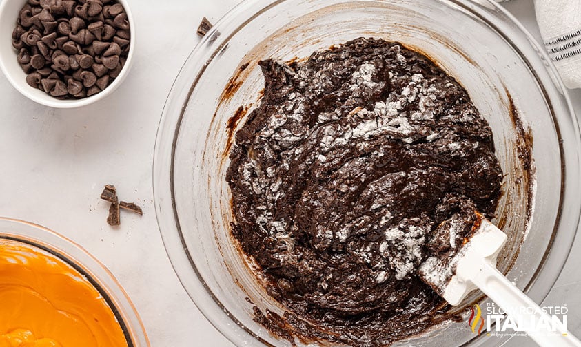 mixing brownie batter with a spatula