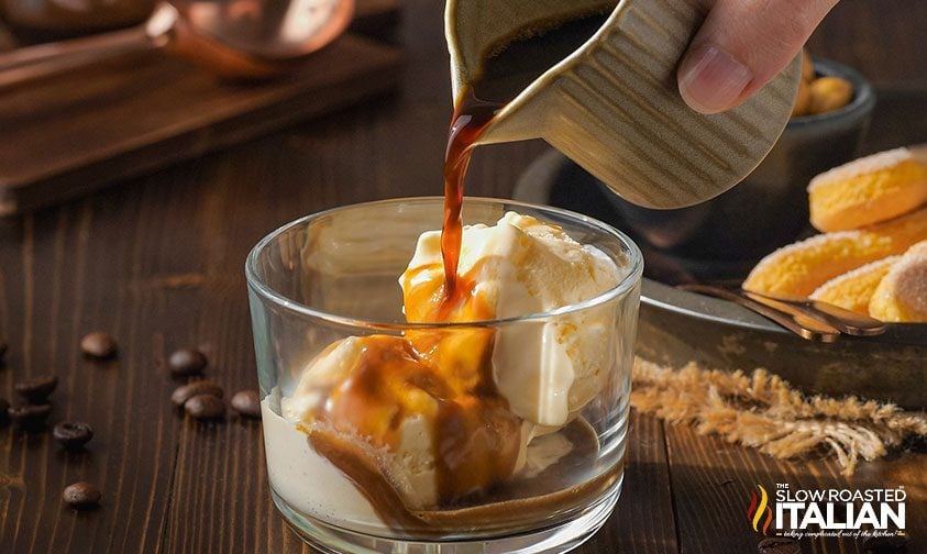 pouring espresso over ice cream in glass dish