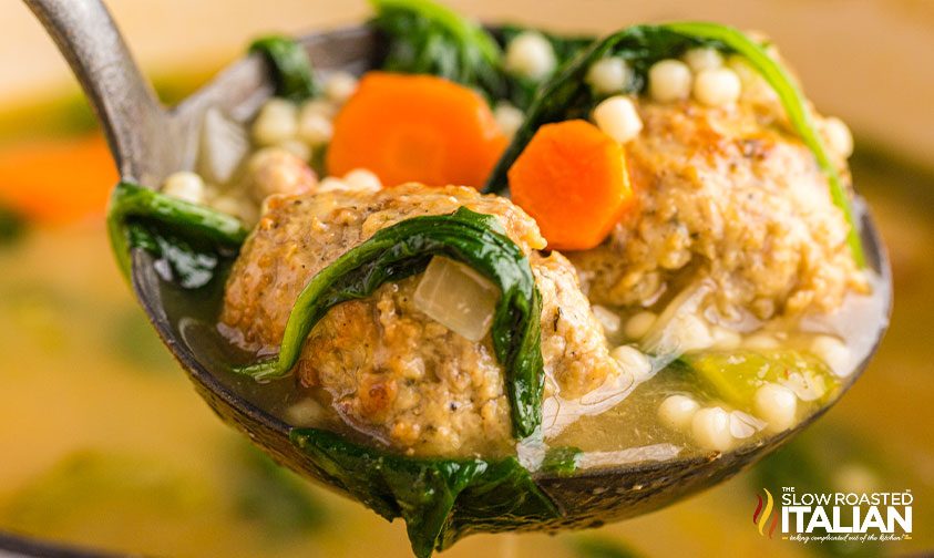 closeup: ladle full of italian wedding soup