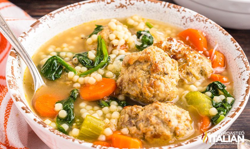 closeup: bowl of italian wedding soup with meatballs