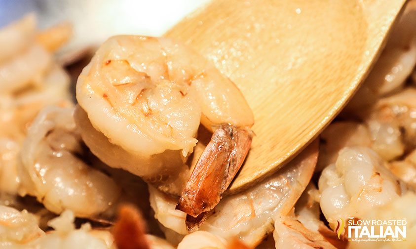 closeup: shrimp coated in lemon butter sauce