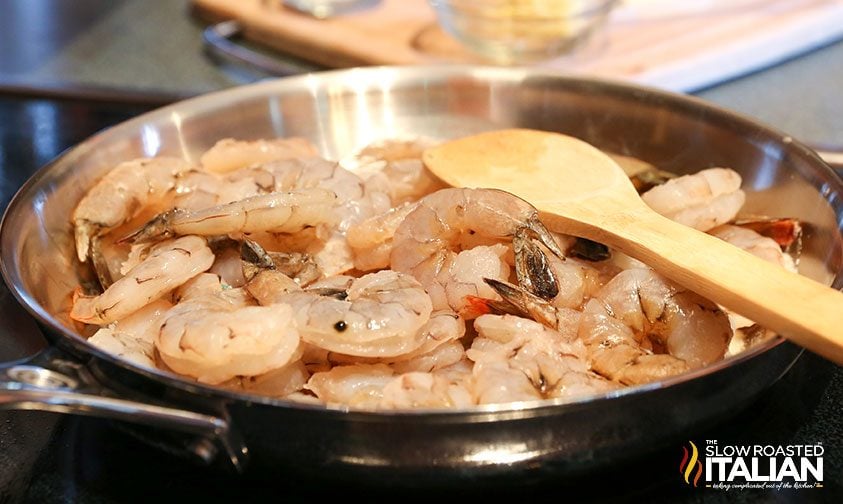 cooking shrimp in a stainless steel skillet