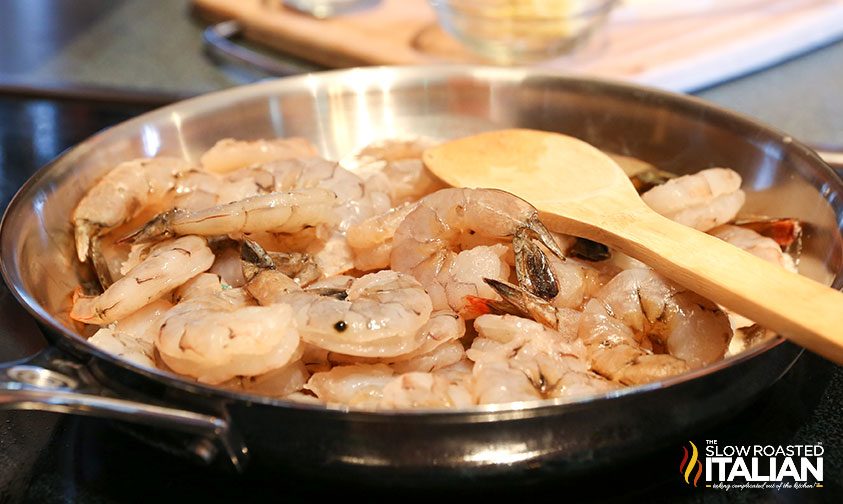 cooking shrimp in a stainless steel skillet