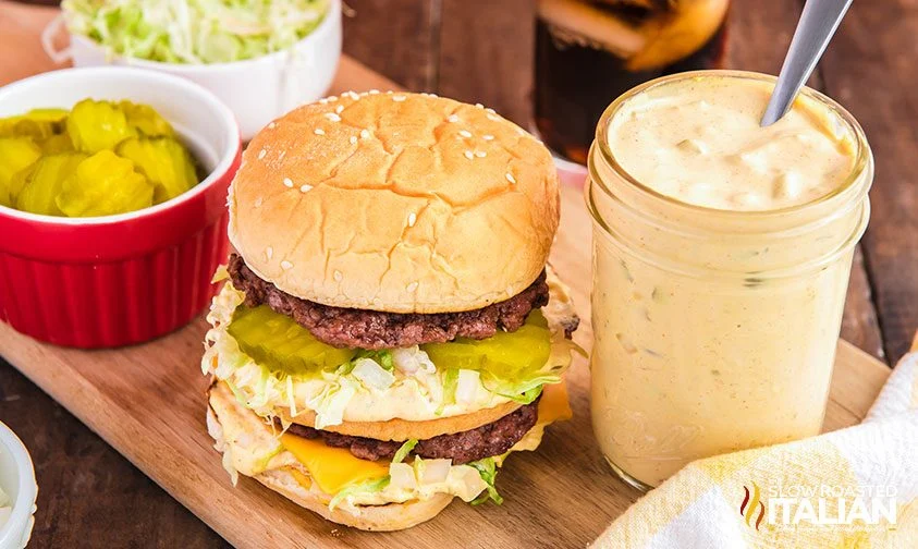 big mac burger next to jar of special sauce