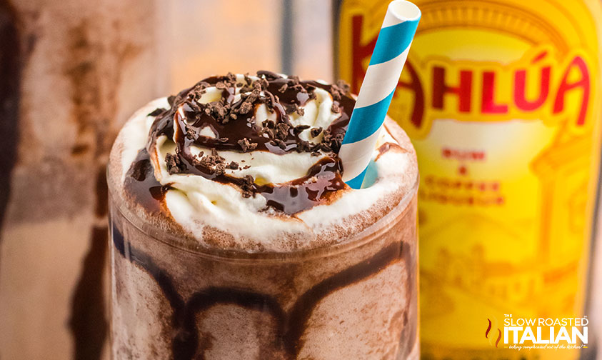 frozen mudslide in tall glass with blue and white straw