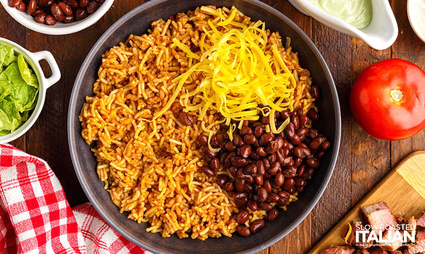 rice, beans, and cheese in bowl
