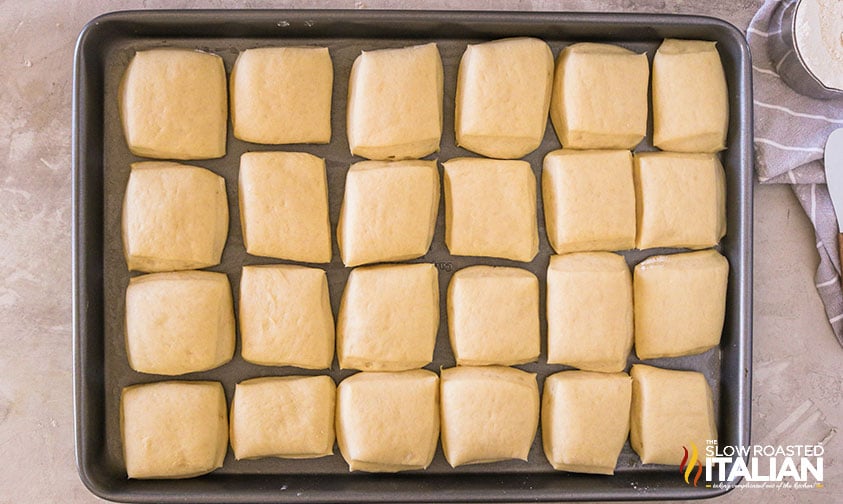 homemade rolls unbaked on sheet pan
