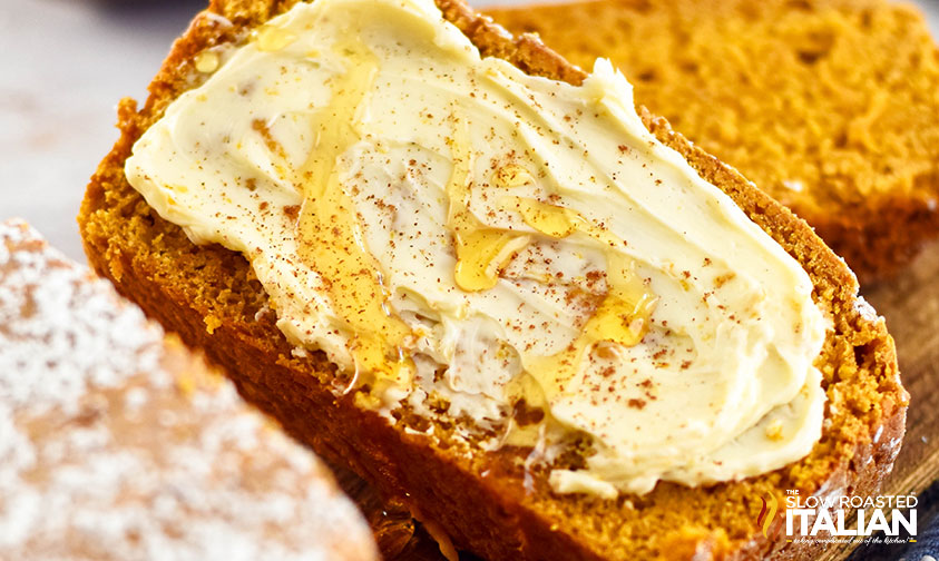 closeup of pumpkin bread with a drizzle of honey