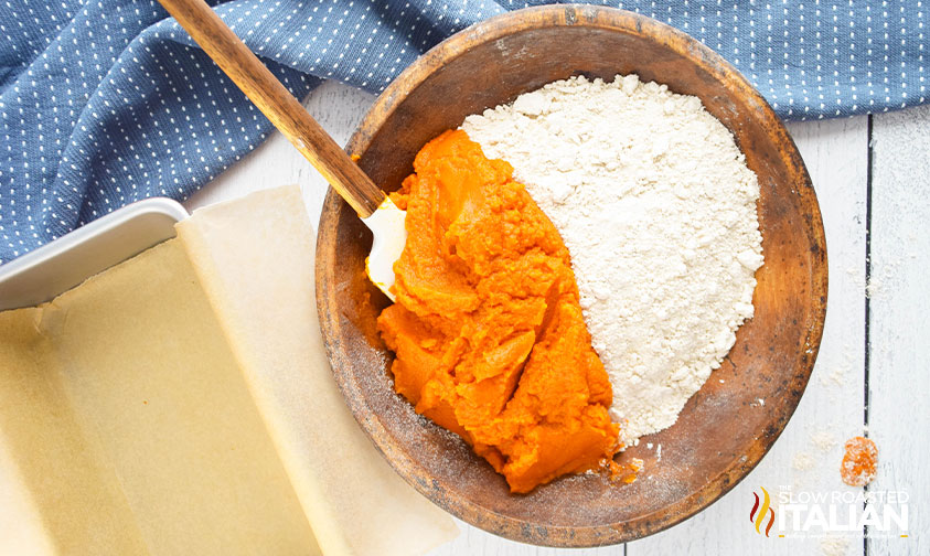 pumpkin and cake mix in a wooden bowl