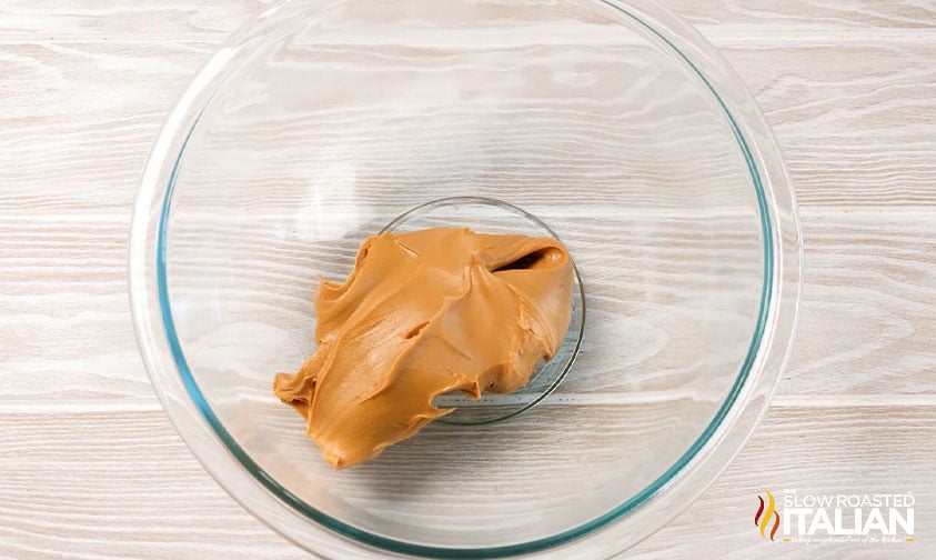 creamy peanut butter in glass bowl