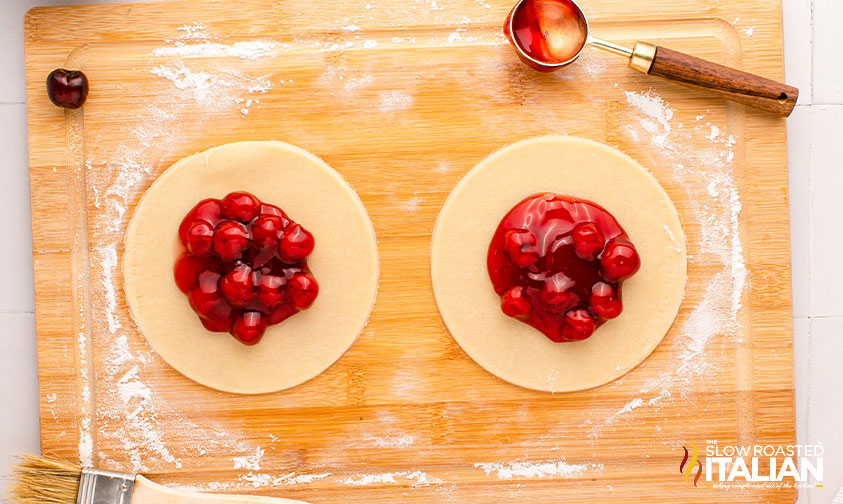 cherry filing on cutout circles of dough